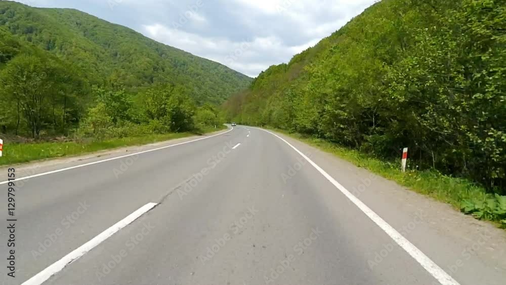 Driving on the highway in the mountains. Point of view camera filming. Driving on the highway in the mountains. Point of view camera filming.