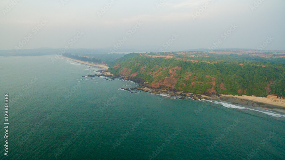 Kalacha beach on sunset. India in Goa. Aerial