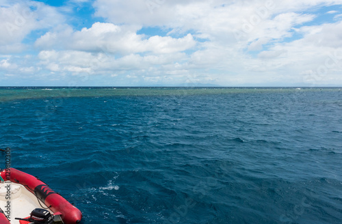 Landscape of a boat floating in the Great Barrier Reef in Queensland, Australia