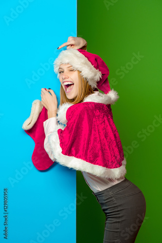 Winking girl with Christmas sock