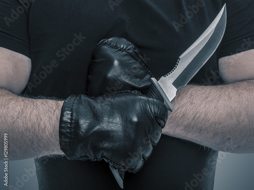 Man with knife in a hand.