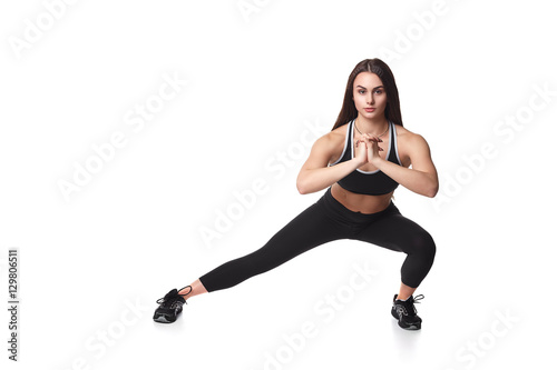 Athletic fitness woman helthy sport isolated white background young female health muscles copy space black clothes smilling attractive beautyful stretch activity copy space empty
