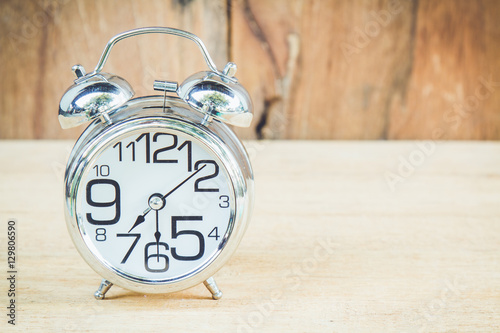 Clock on wood background