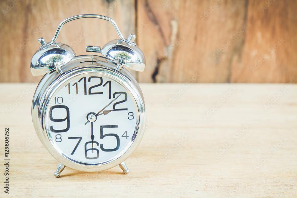 Clock on wood background