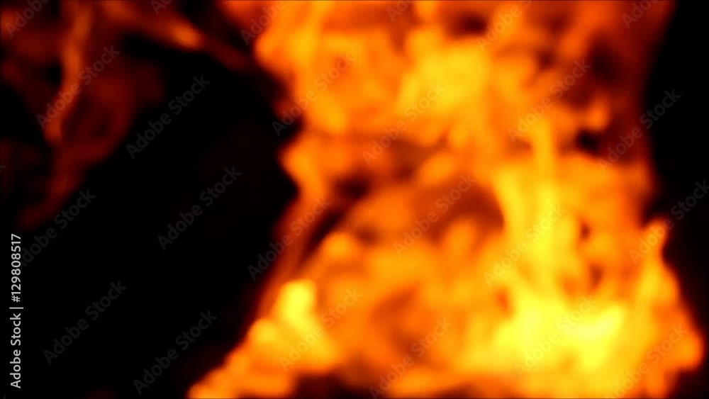 Burning wood logs in fireplace. Blurred Fire background Burning wood logs in fireplace. Blurred Fire background