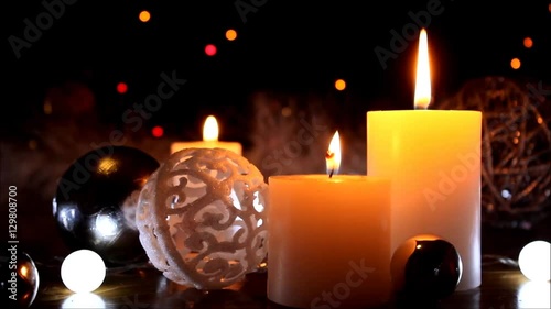 Christmas decoration background with burning candles. Burning white candles