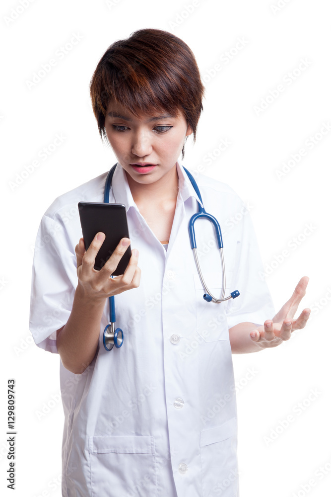 Asian young doctor woman upset with mobile phone. Asian young doctor woman upset with mobile phone.