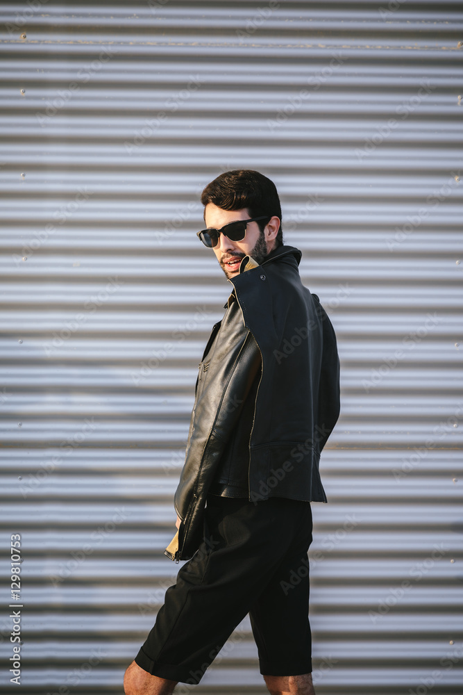 Man in sunglasses posing for camera Man in sunglasses posing for camera