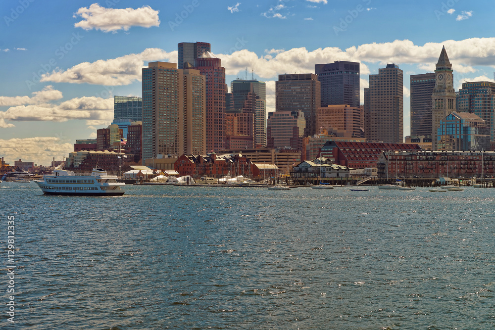 Floating boat with the skyline of Boston in the background