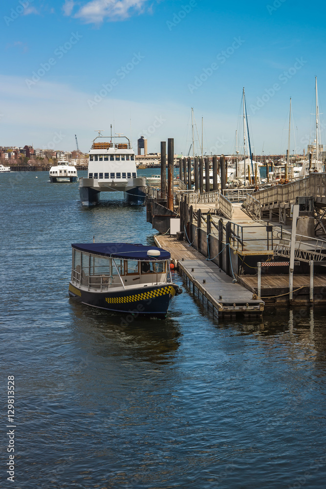 Fototapeta premium Pier of Boston Wharf with sail boat and Charles River