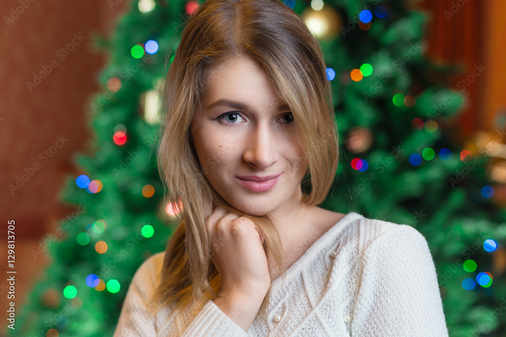 Beautiful woman portrait.,christmas tree lights background. happ Beautiful woman portrait.,christmas tree lights background. happ