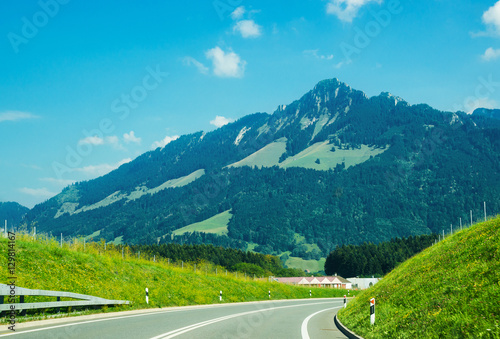Road and Prealps mountains in Gruyere of Fribourg Switzerland