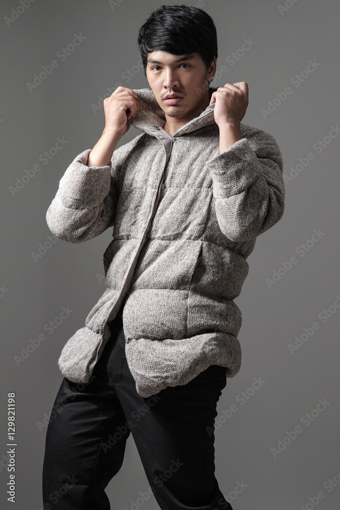Portrait of asian man in gray knitting coat - Fashion and style