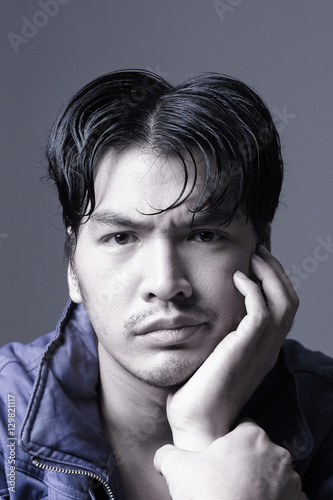 Portrait of Asian man in purple jacket - Head shot