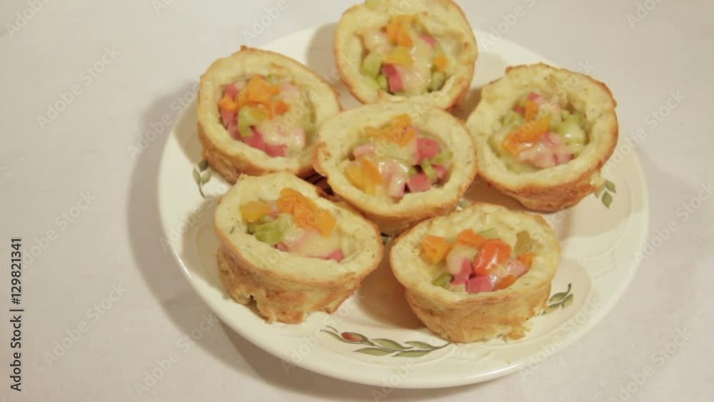 Delicious breakfast in potato basket with sausage, cucumber, bell pepper and cheese. Delicious breakfast in potato basket with sausage, cucumber, bell pepper and cheese.