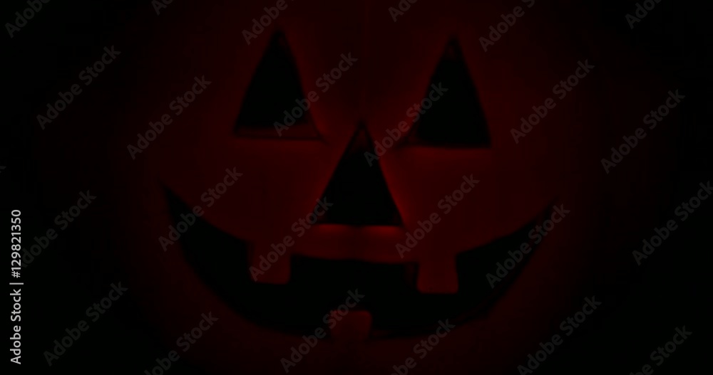 Close up of a Halloween scary pumpkins isolated on a black background Close up of a Halloween scary pumpkins isolated on a black background