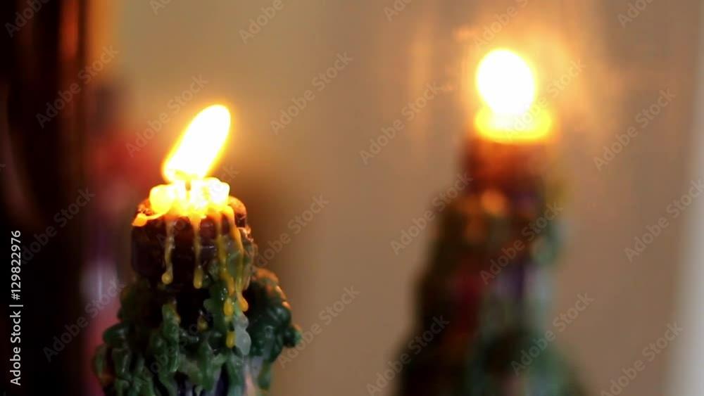 mirror reflection of burning candle