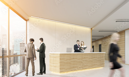 People cooperating in a wooden office