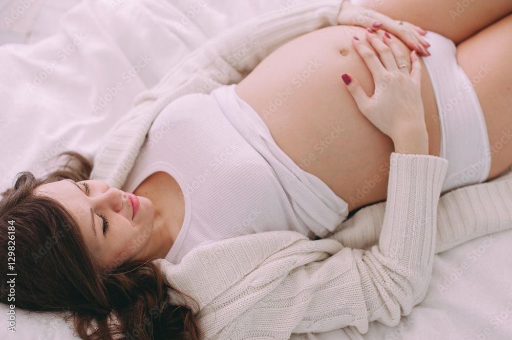 Happy pregnant young woman waiting for a child Happy pregnant young woman waiting for a child