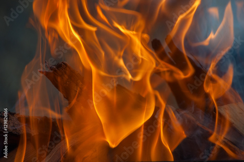 burning fire in a brick fireplace close up