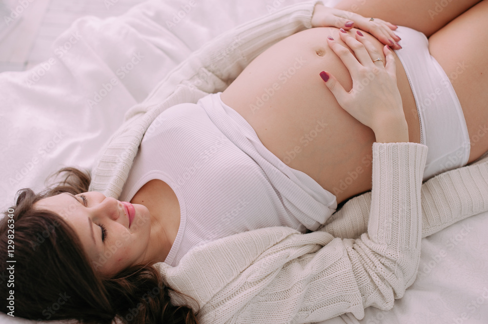 Happy pregnant young woman waiting for a child Happy pregnant young woman waiting for a child