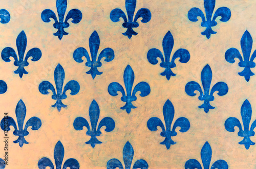 Majestic blue Fleur-de-lis pattern painted on a wall in Palazzo Vecchio - a museum in Florence, Italy
