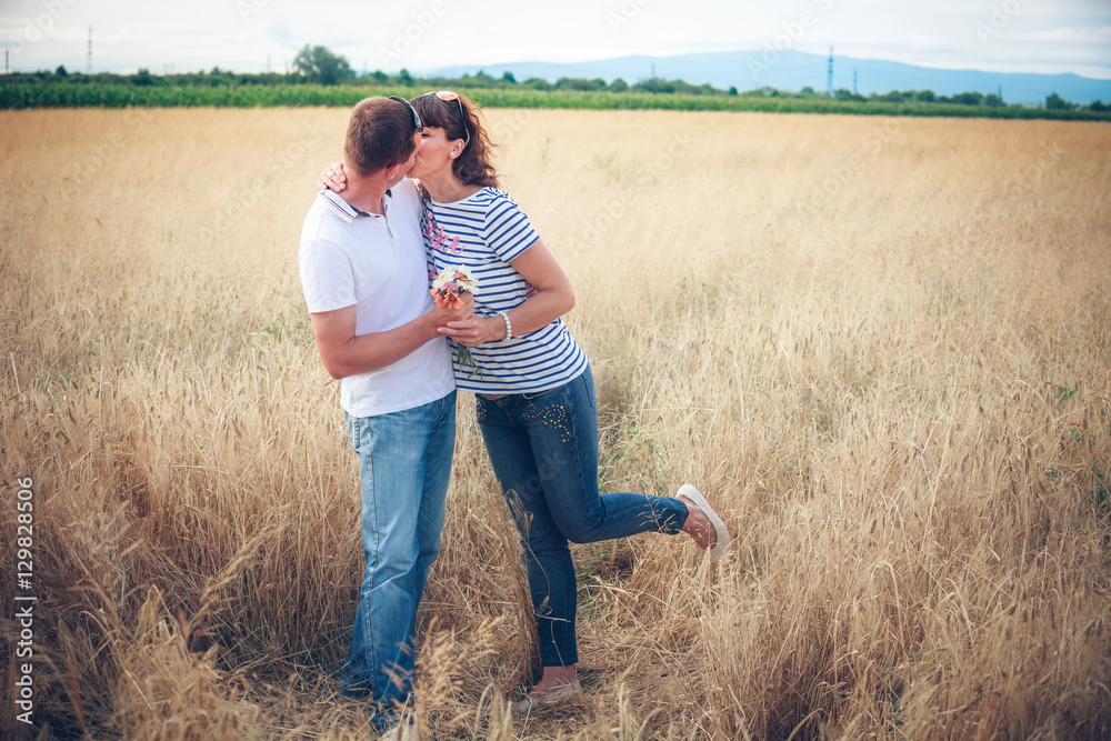 Happy couple on wheat field