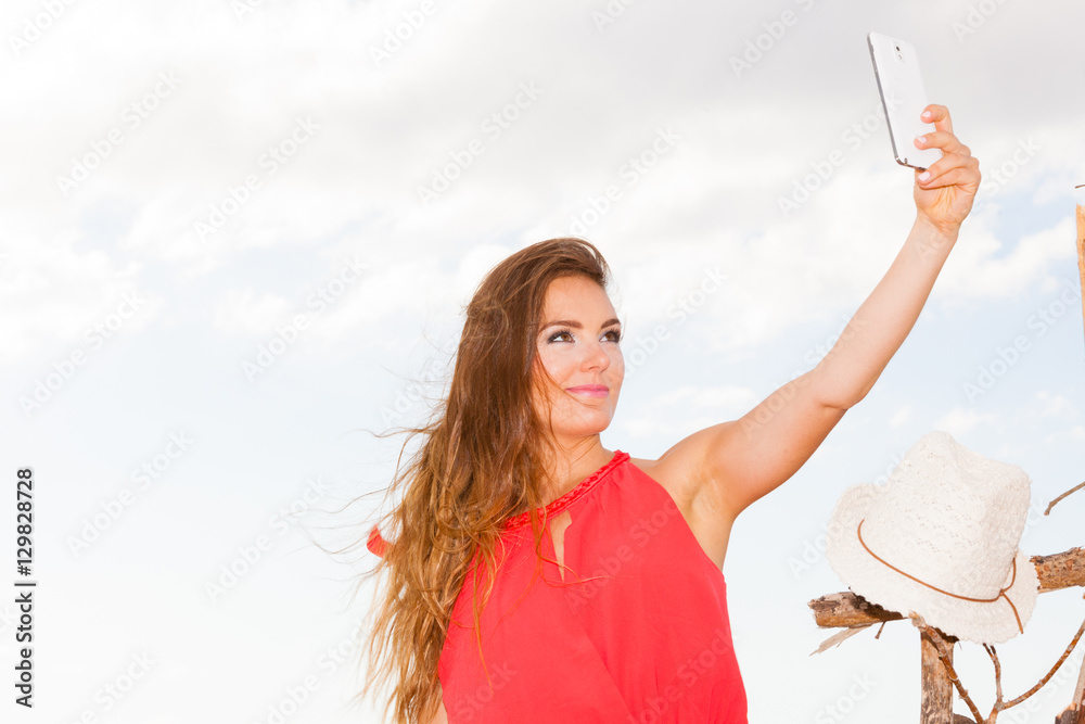 Happy woman with phone taking selfie photo. Happy woman with phone taking selfie photo.