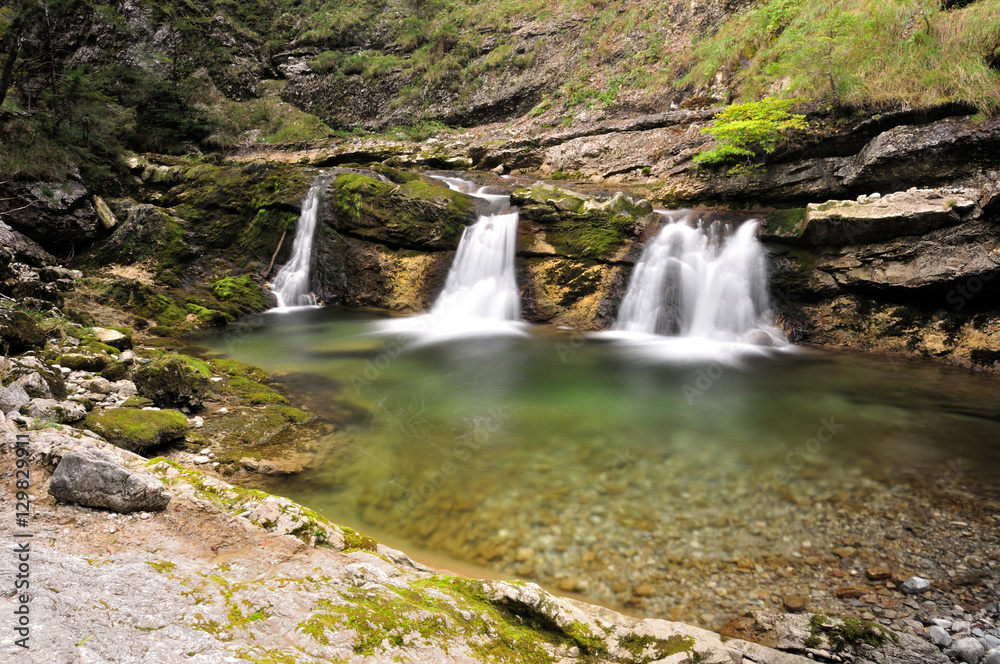 long exposure of three little waterfalls at a mountain creek in Bavarian Alps