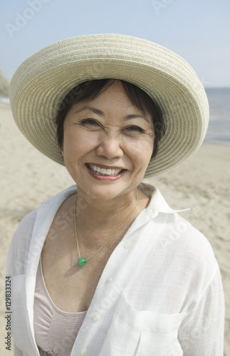 Woman smiling on beach (close-up) (portrait)