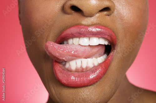 Close up of woman sticking out tongue