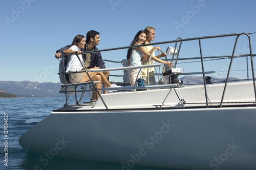 Group of multi ethnic friends travelling on a sailboat © moodboard