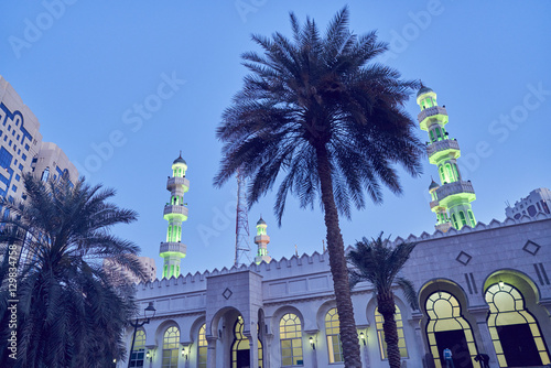 United Arab Emirates, Dubai, Illuminated Grand mosque under blue sky at dusk photo