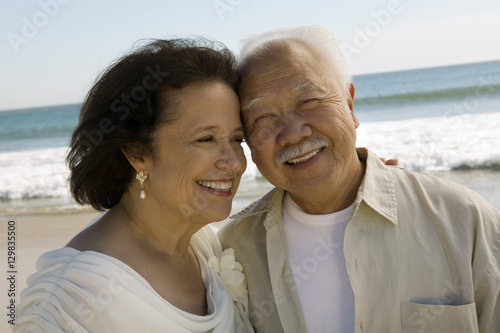 Senior Newly wed couple at beach (close-up)