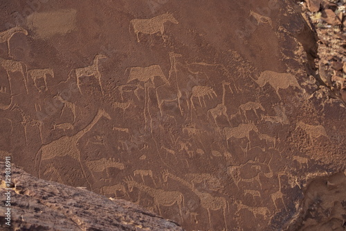 Etchings on sandstone, 6000 years old, finest rock art in Africa, Twyfelfontein, Damaraland, Namibia photo