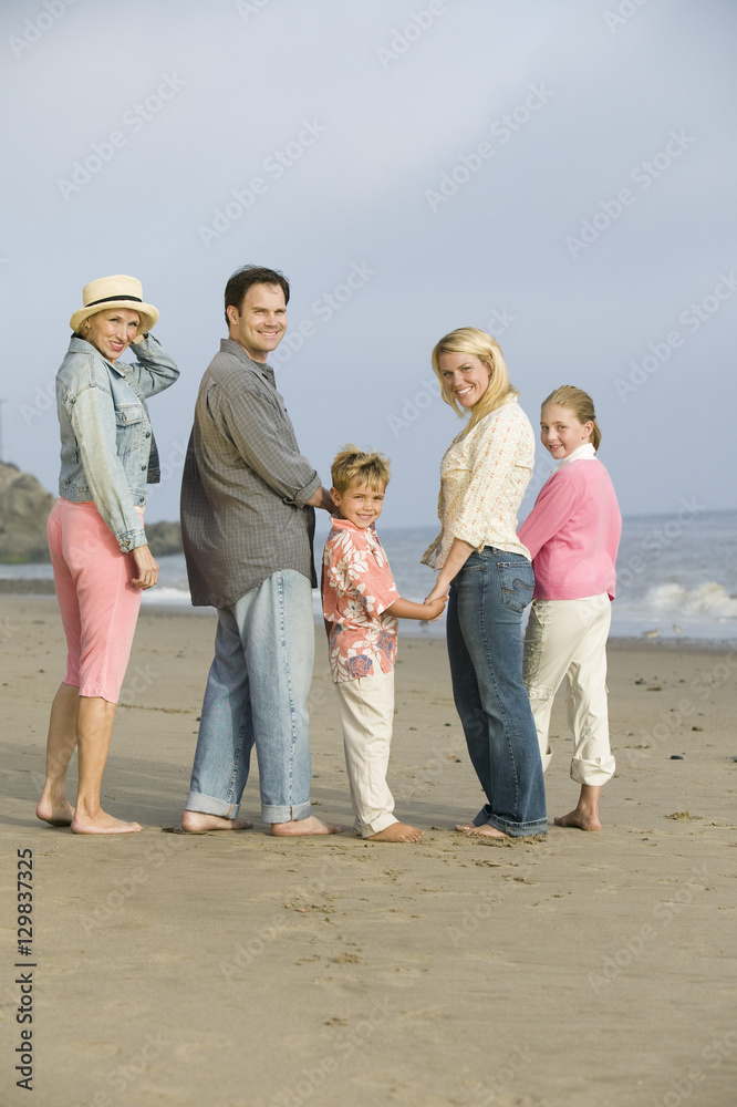 Family standing on beach portrait Family standing on beach portrait