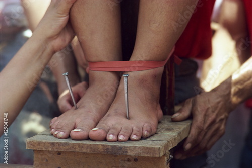 Lucy Reves crucifixion during Holy Week at Easter in Capitanan village in Bulacan Provice, Philippines