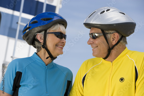 Happy senior couple in sportswear looking at each other