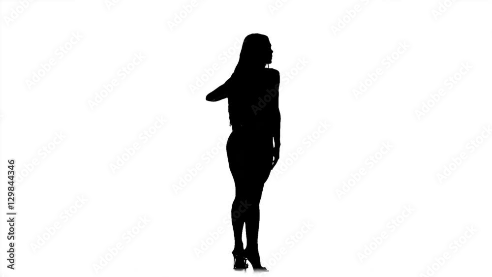Silhouette bodybuilding girl posing on white background in black and white. Slow motion. Silhouette bodybuilding girl posing on white background in black and white. Slow motion.