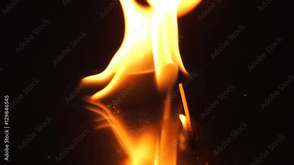 Slow motion of falling matchstick lights a flammable liquid, Two shot
