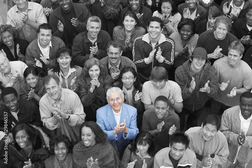 Fototapet Elevated view of multiethnic group applauding together