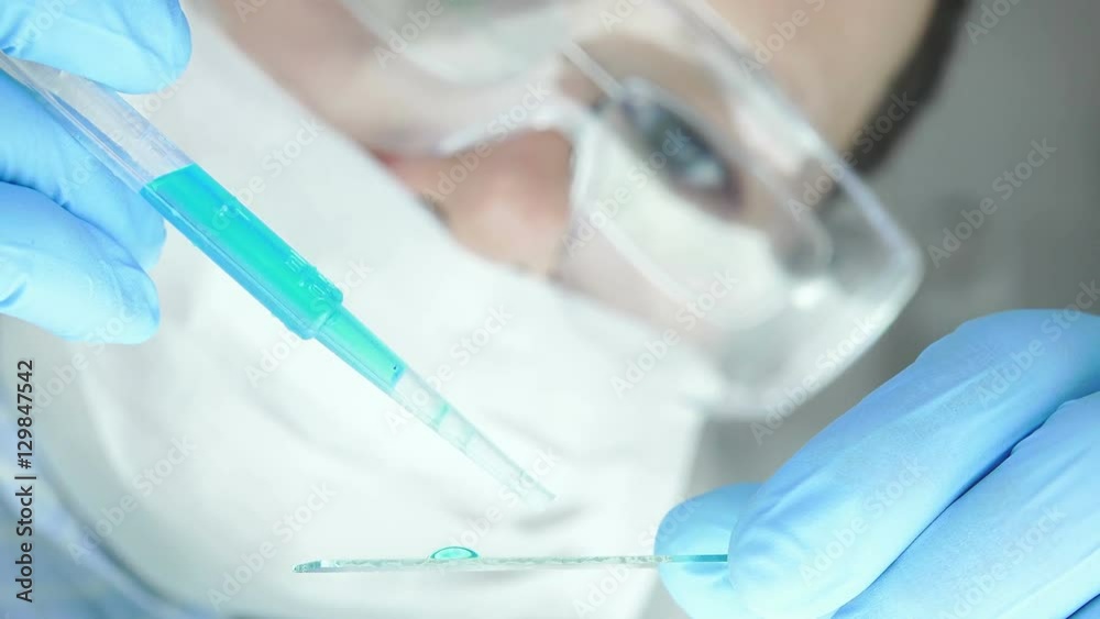 white woman reseracher accurately managing a chemical sample white woman reseracher accurately managing a chemical sample