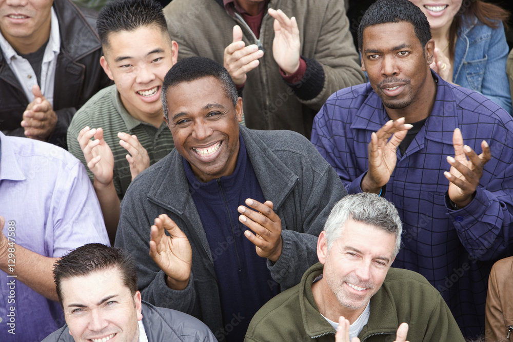 Fototapeta premium High angle view of happy multiethnic people clapping