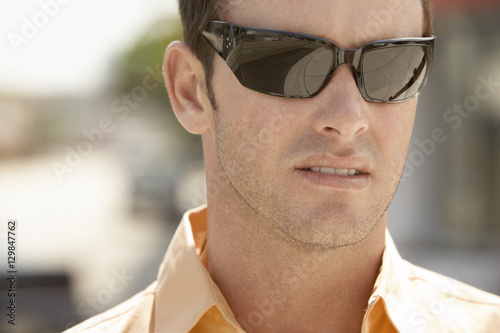 Closeup of Caucasian man wearing sunglasses