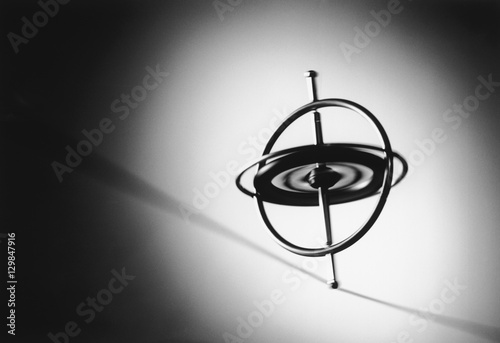 Gyroscope spinning on wire photo