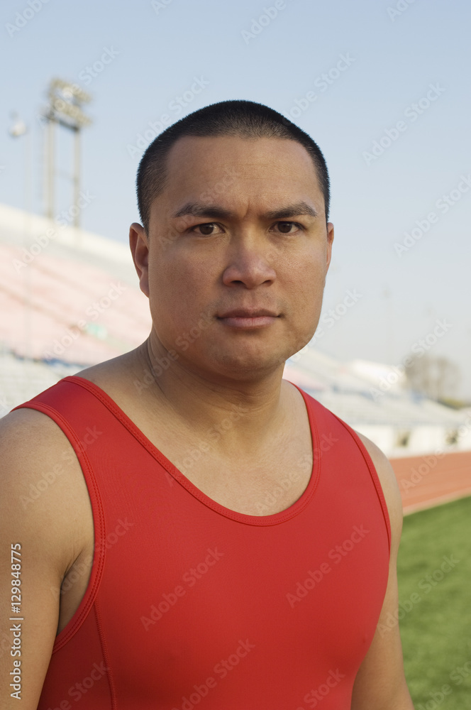 Portrait of confident mature man in an athletic field Portrait of confident mature man in an athletic field