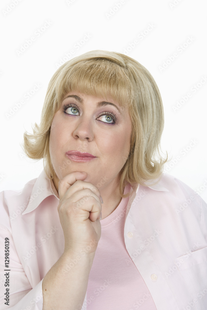 Mature woman thinking isolated over white background Mature woman thinking isolated over white background