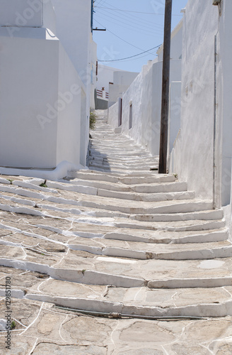 Stone steps up a path through the houses of Pano Petali in Sifnos, The Cyclades, Greek Islands, Greece photo