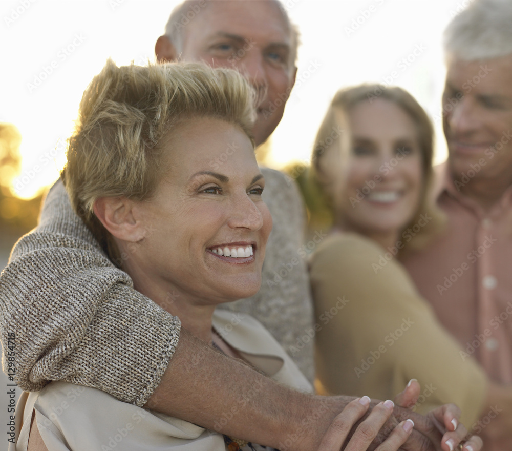 Happy senior couples spending time together on tropical beach Happy senior couples spending time together on tropical beach