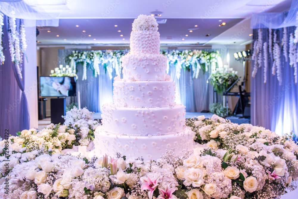 A beautiful wedding cake with decoration at wedding reception room ...